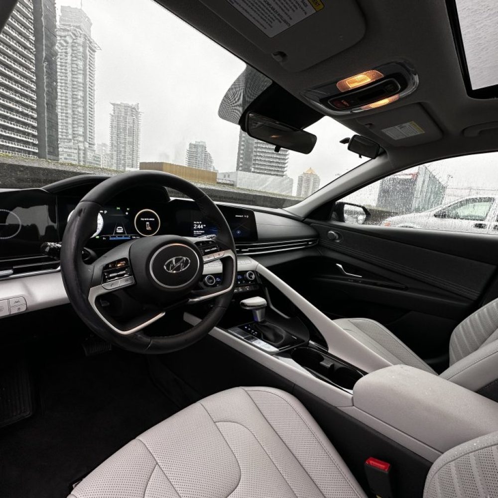 Hyundai car interior with city buildings view